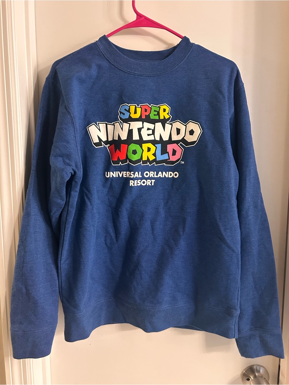 Nintendo Blue Sweatshirt with Multicolor Super Nintendo World Logo